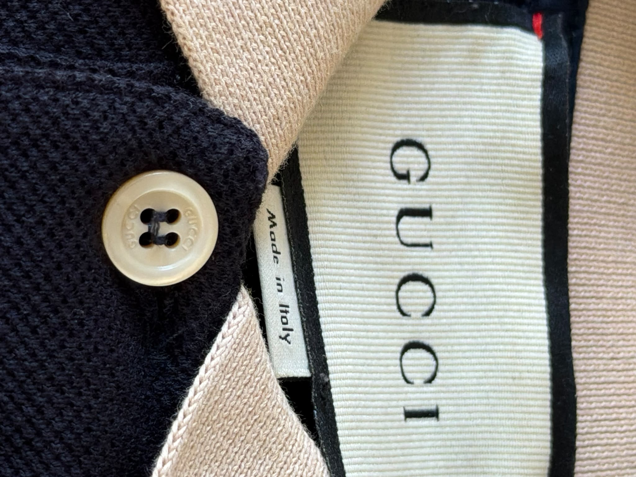 Gucci navy polo with beige Interlocking G shoulder stripe
