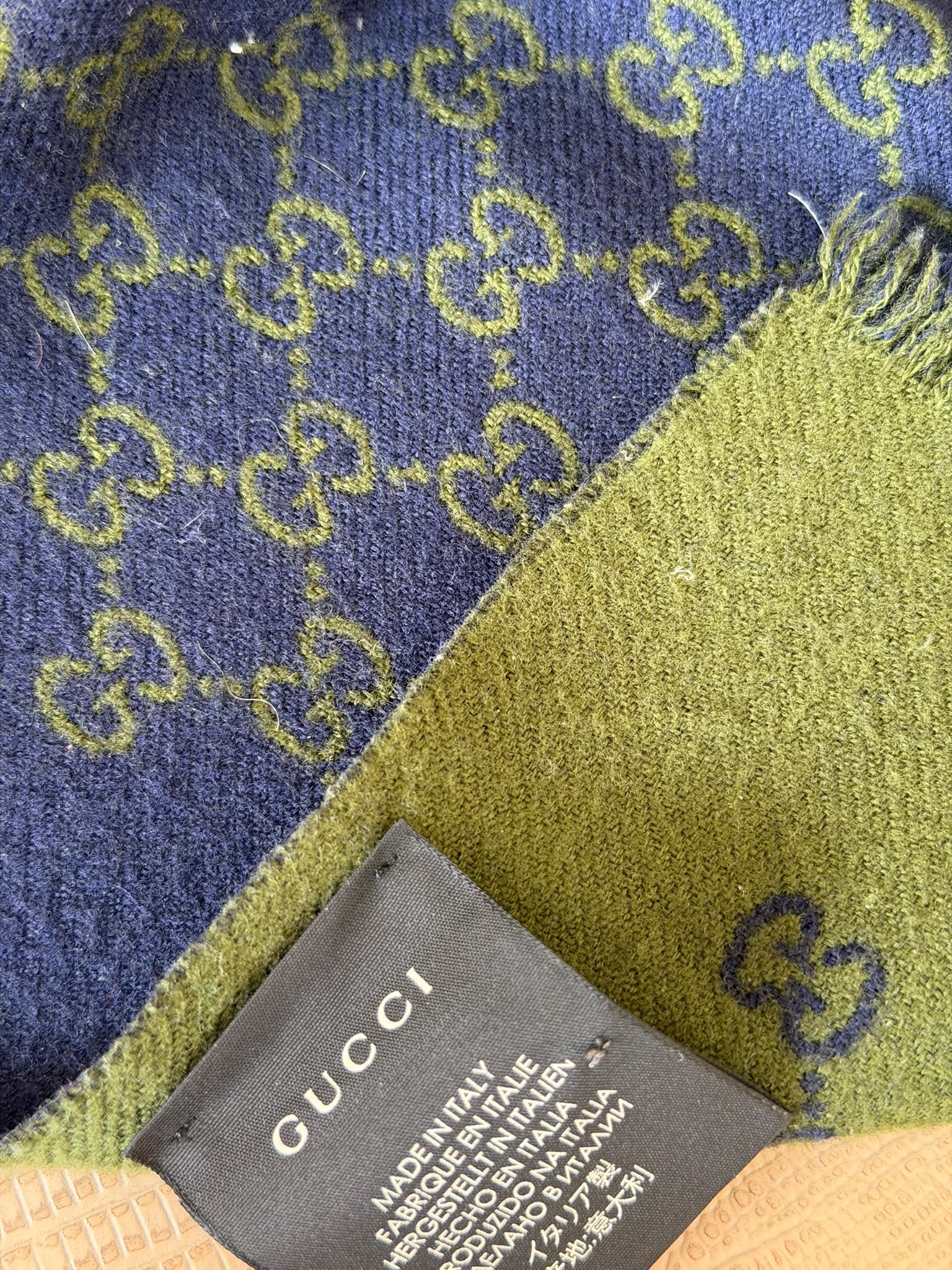 Gucci GG scarf label and red stitching