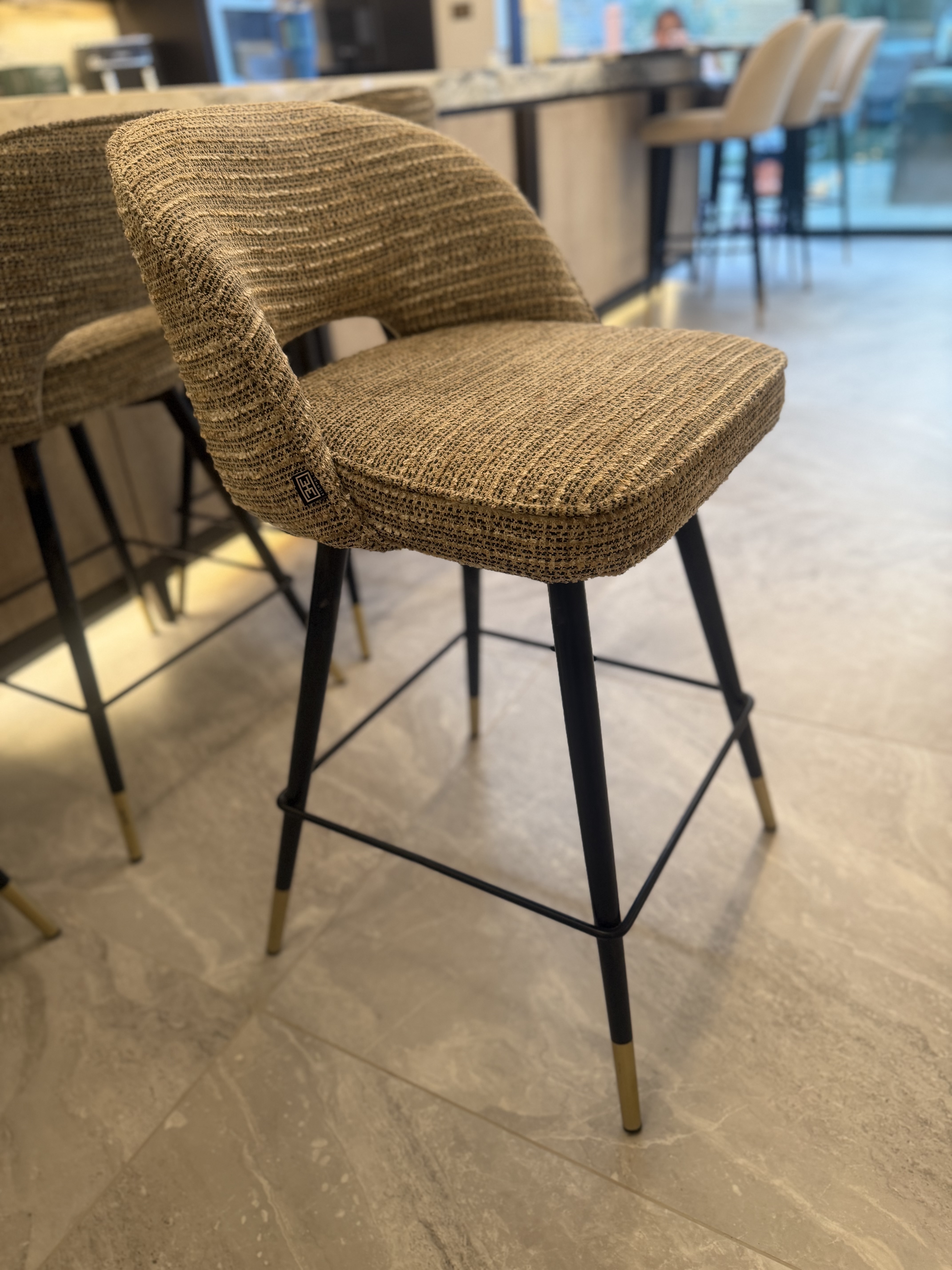 Close view of Eichholtz Cliff textured Mademoiselle Beige upholstery