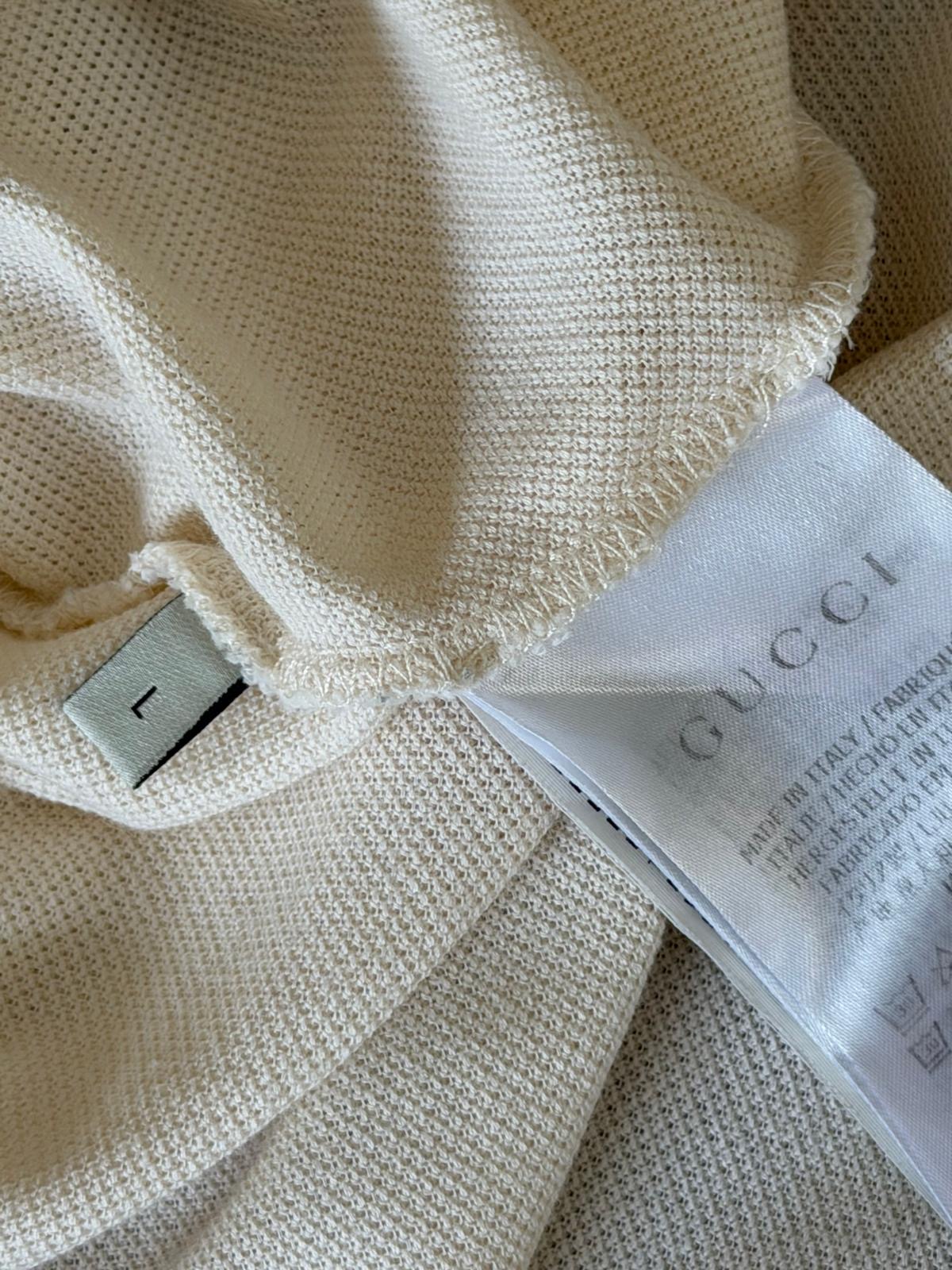 Gucci neck label on Interlocking G stripe polo