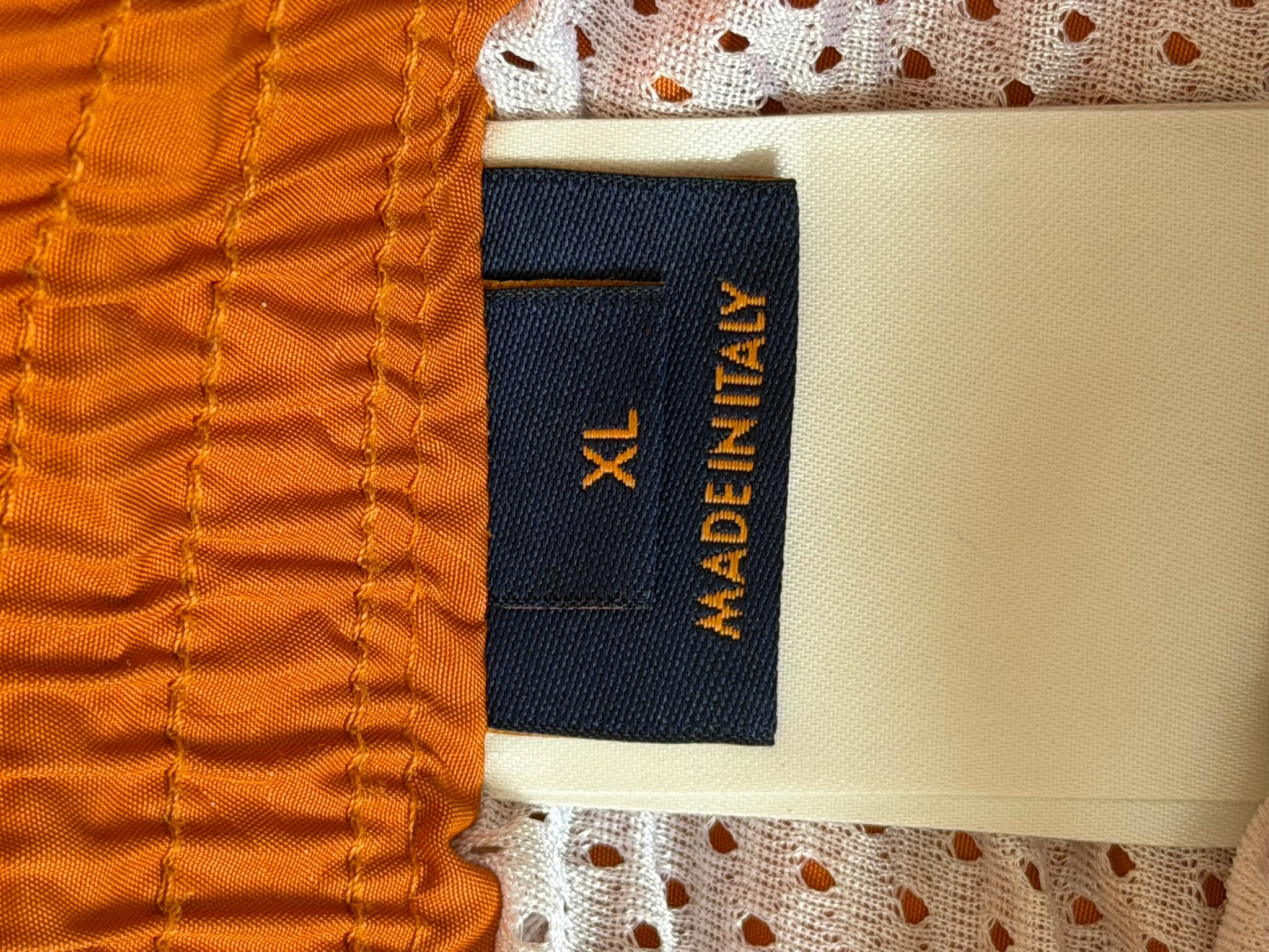 Louis Vuitton size XL Made in Italy label on orange swim shorts