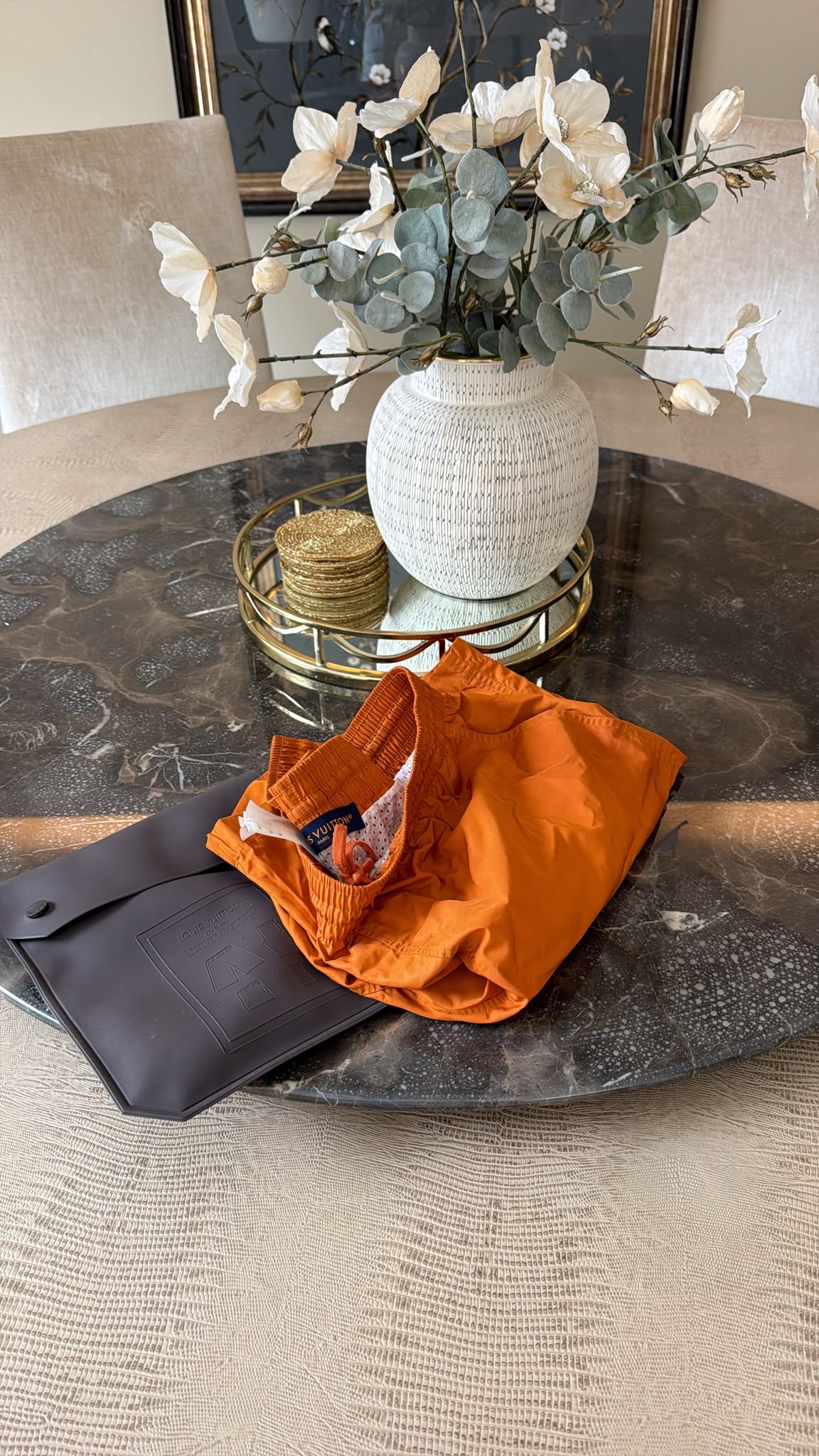 Louis Vuitton orange swim shorts with white mesh lining