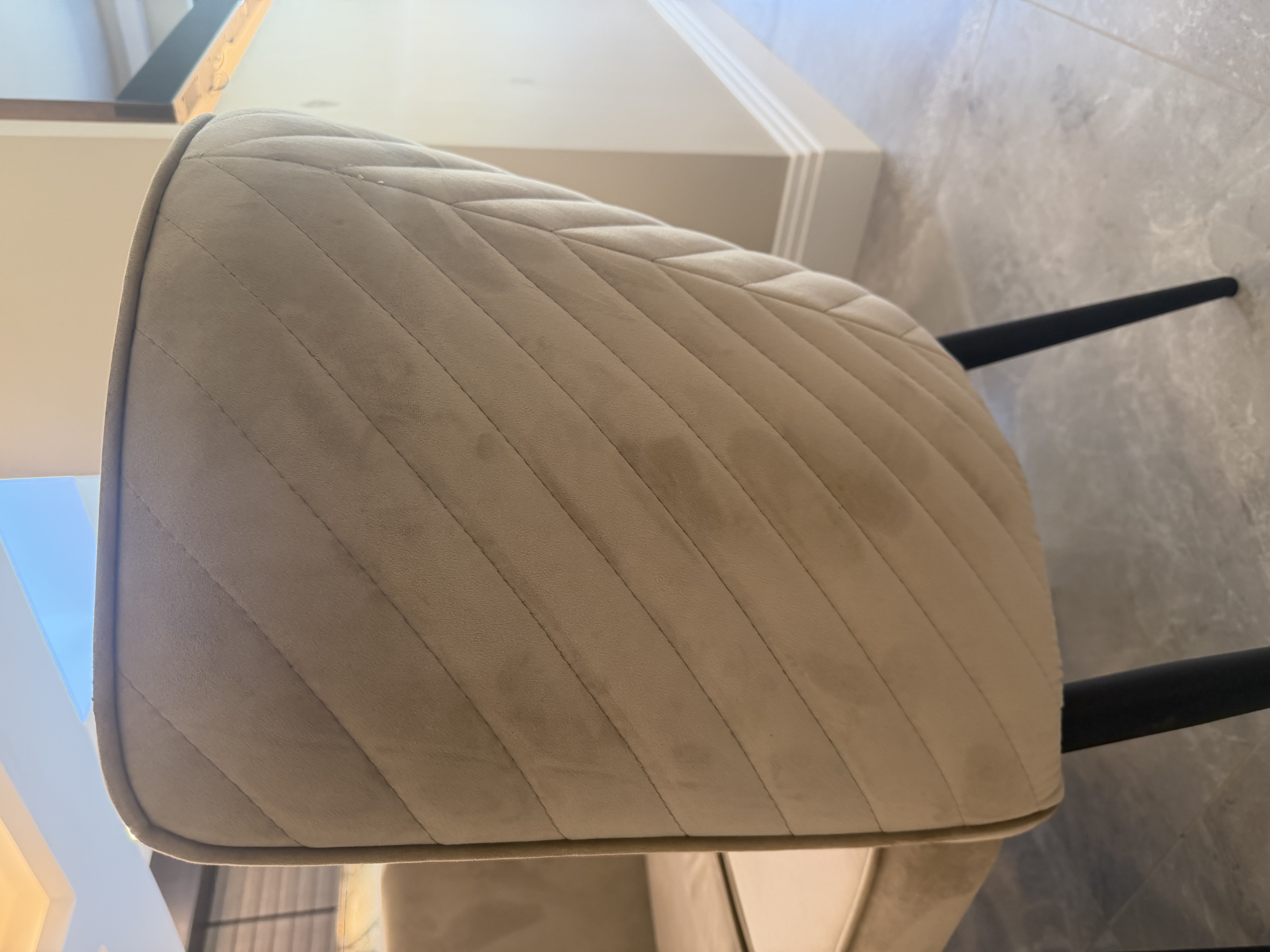 Danetti Serena dining chairs showing padded champagne velvet seats